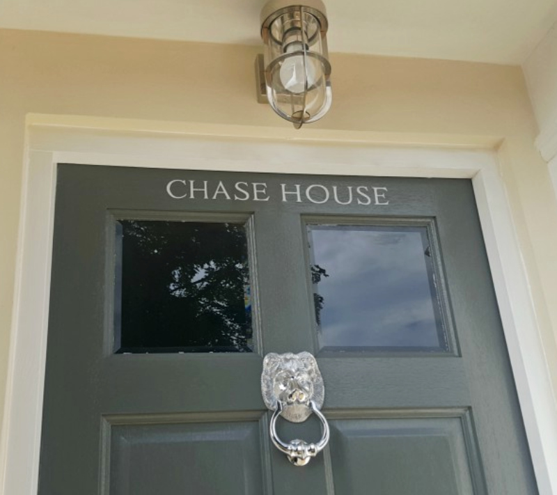 Hand painted house name on the entrance door of Chase House in Enfield.