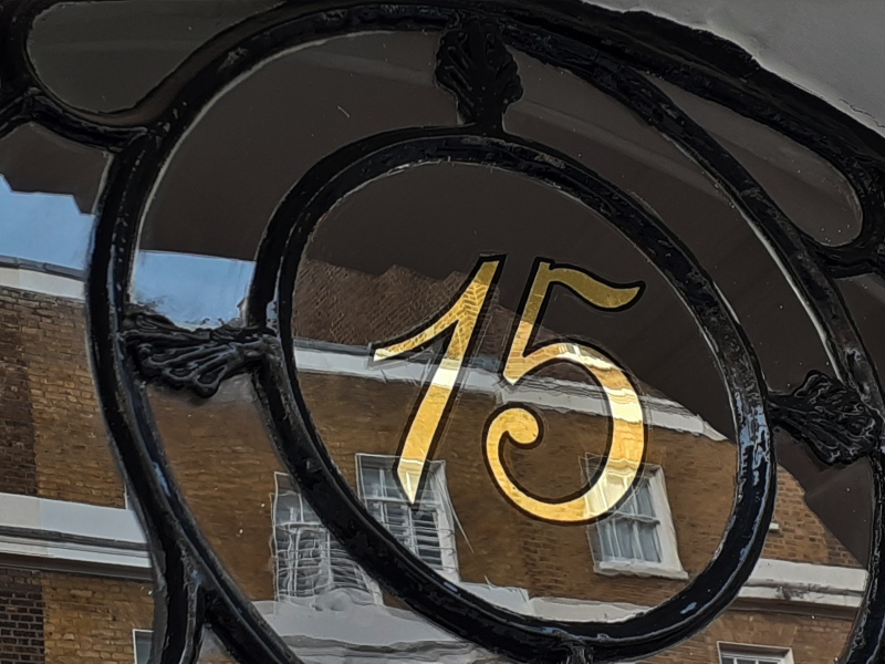 Traditional 23ct gold leaf fanlight numbering completed for the entrance of a Regency townhouse near Hyde Park, London.