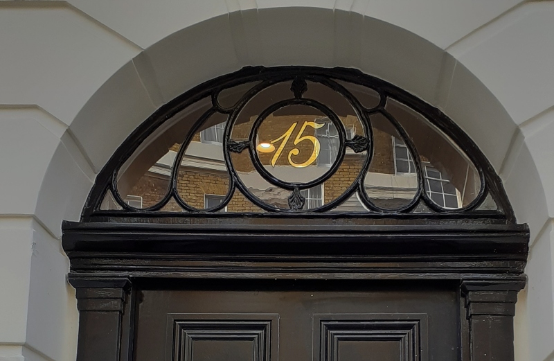 Traditional 23ct gold leaf fanlight numbering completed for the entrance of a Regency townhouse near Hyde Park, London.