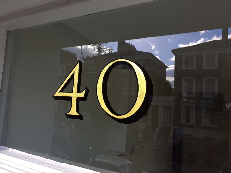 Completed 23ct gold leaf fanlight numbering on the entrance of a late Victorian townhouse in Stoke Newington.