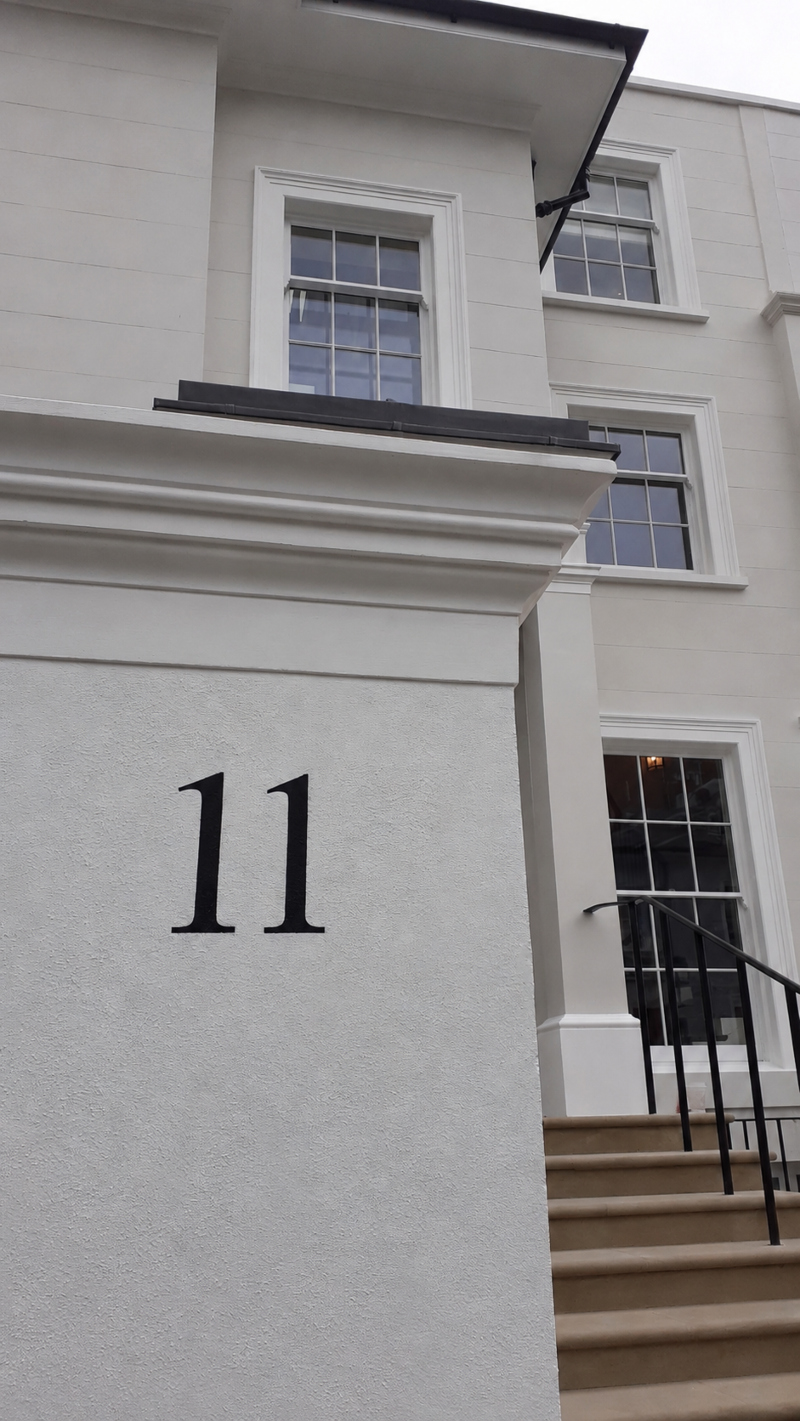 Completed architectural entrance pier numbering hand painted onto a rendered entrance pier at a distinguished 