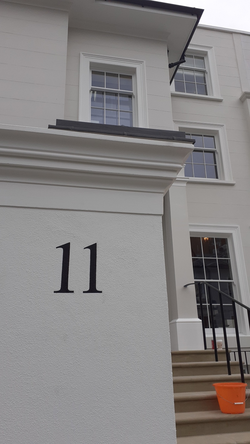 Completed architectural entrance pier numbering hand painted onto a rendered entrance pier at a distinguished Kensington residence.