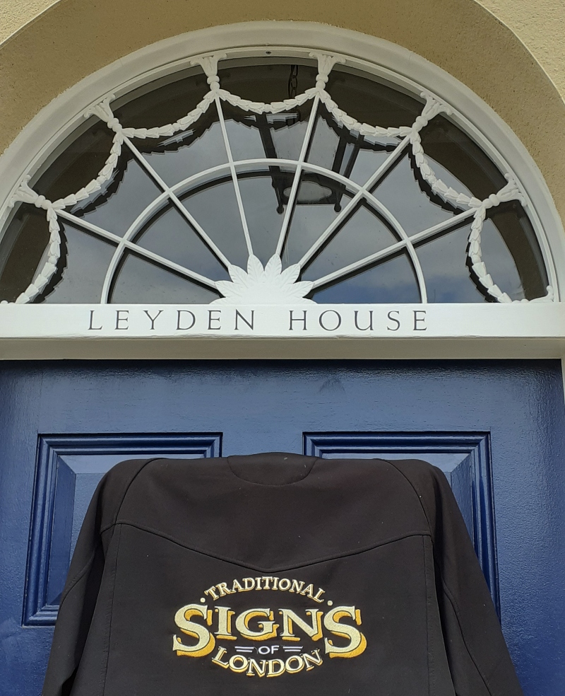 Traditional house name lettering on historic entrance doorway