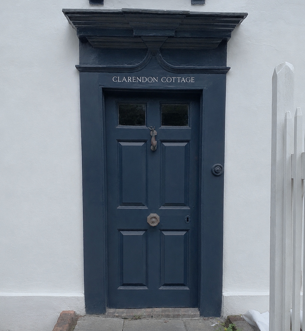 Hand painted cottage name signwriting in Enfield