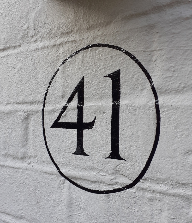 Painted brick property numbering on London residence