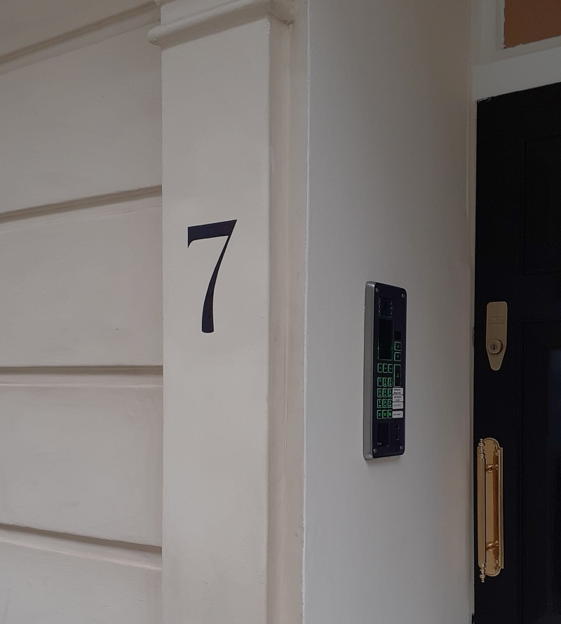 Rendered masonry entrance numbering painted by hand