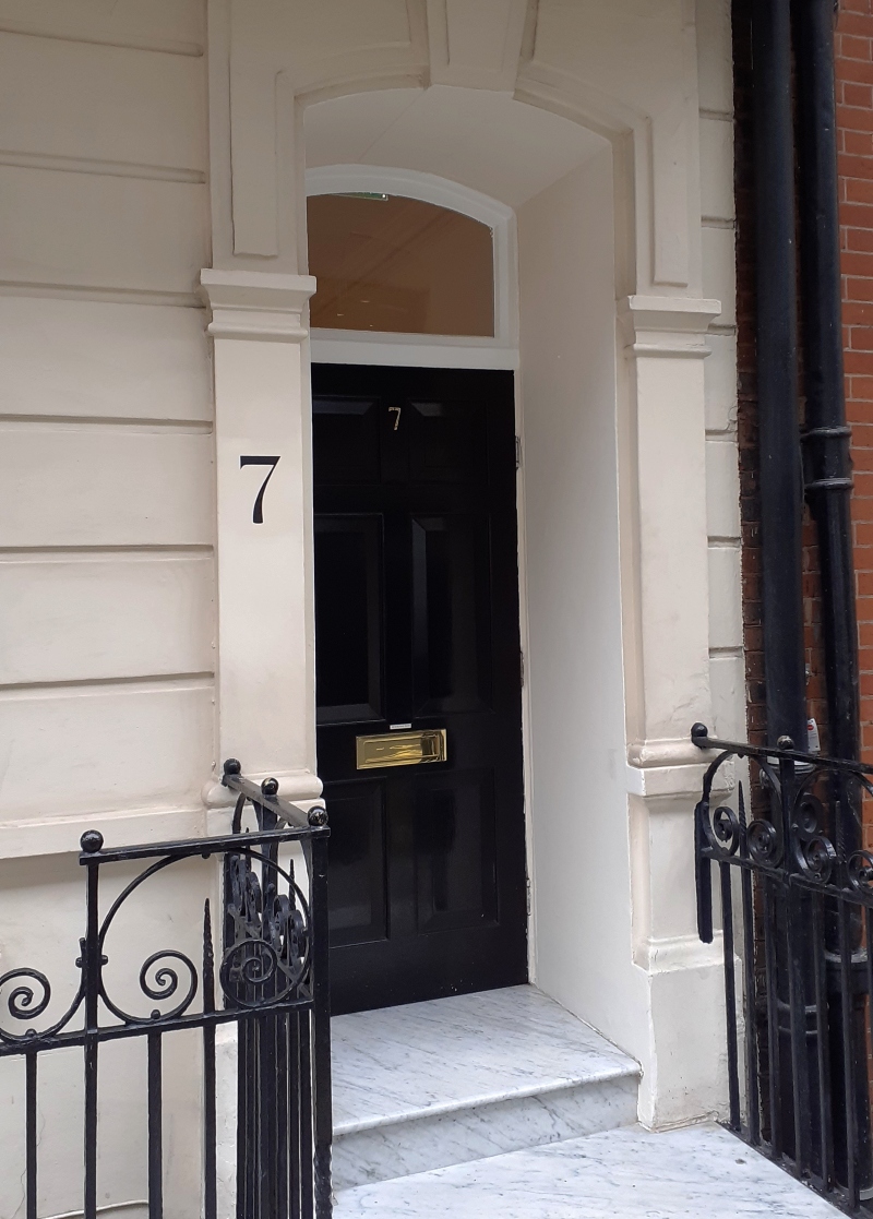 Traditional masonry number signwriting in London