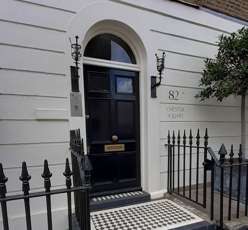 Bespoke exterior address lettering on stucco façade