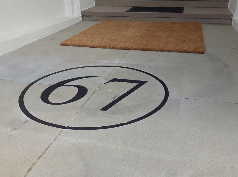 Decorative entrance floor numbering painted by hand
