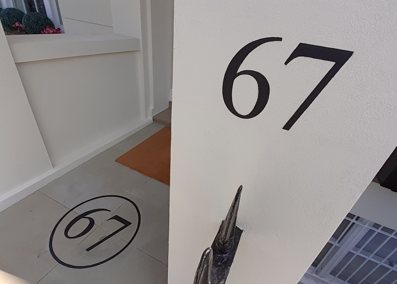 Hand painted architectural numbering on West London property