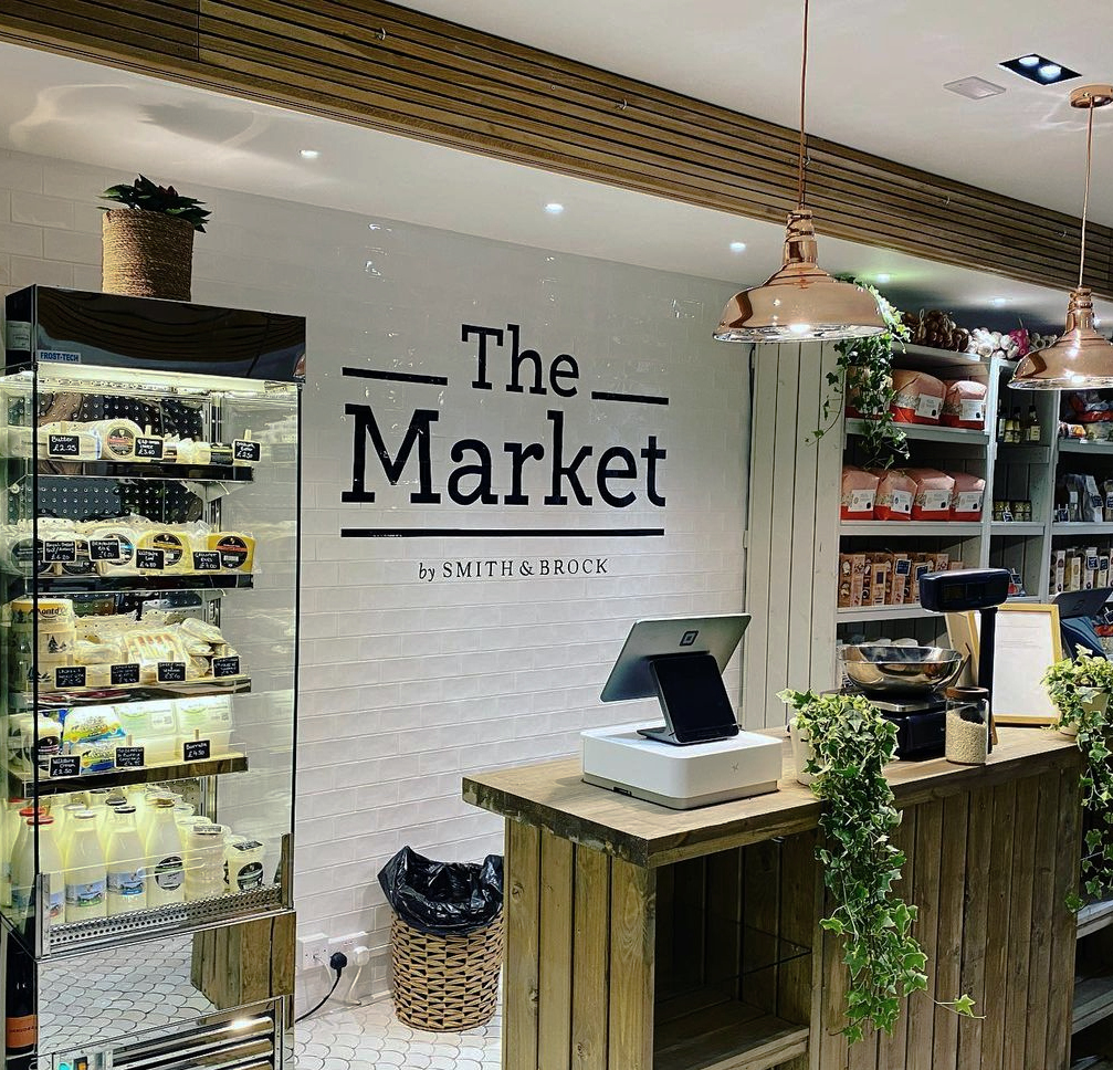 Hand painted interior signwriting on tiled wall in South Kensington