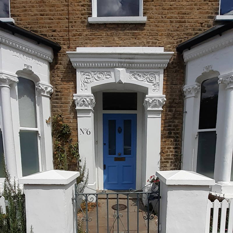 Hand painted house number signwriting on South London Victorian property