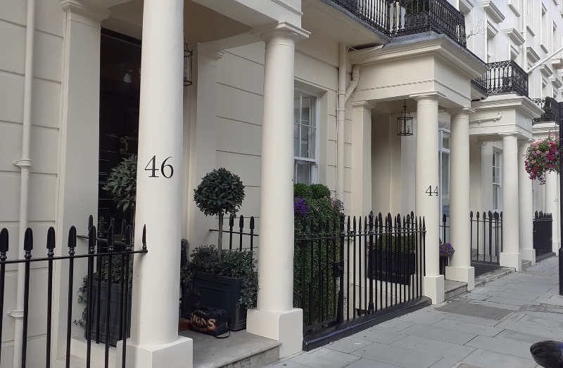 Traditional pillar number signwriting on West London property
