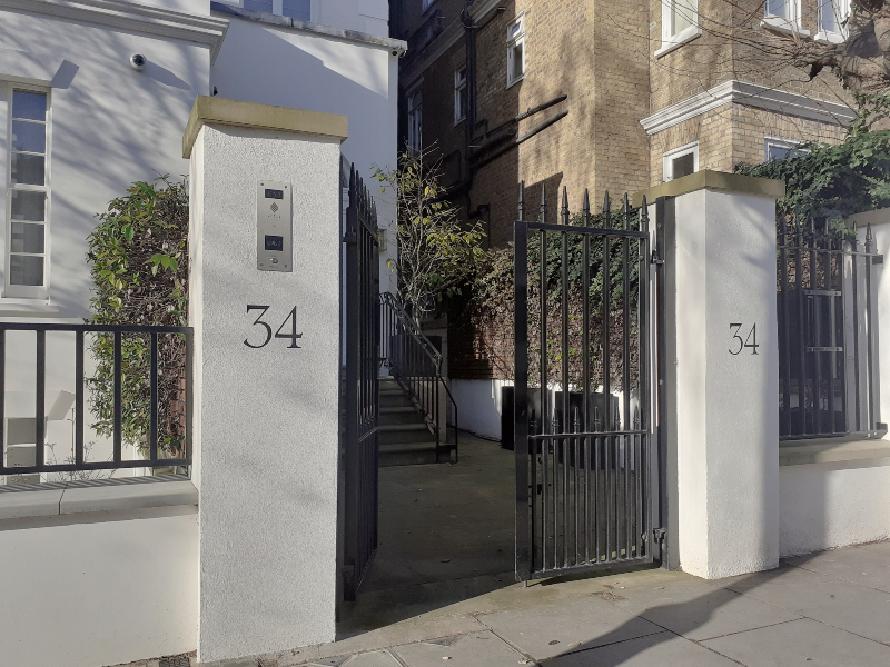 Bespoke painted house numbers on traditional Kensington gate piers