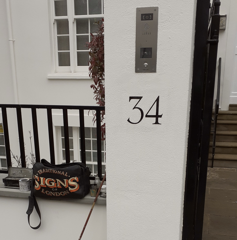 Traditional hand painted house number signwriting in London Kensington