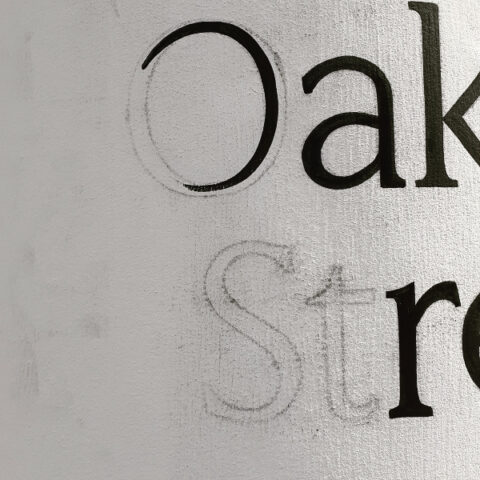 Close-up detail of hand painted house numbers in London