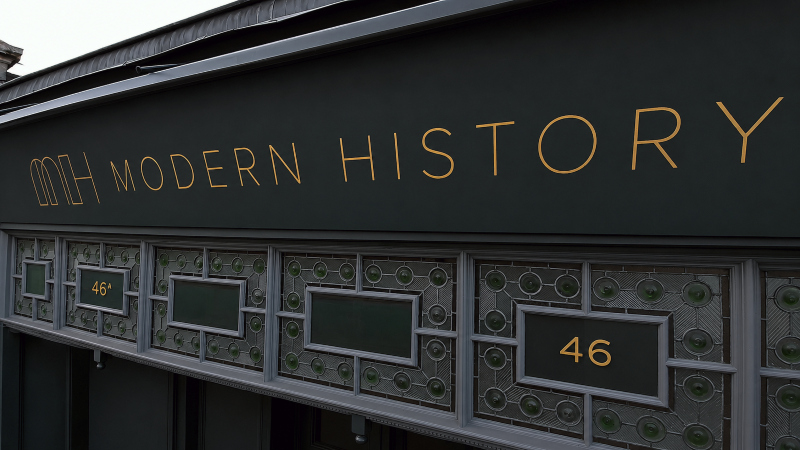 Finished gold leaf signwriting on traditional London shopfront