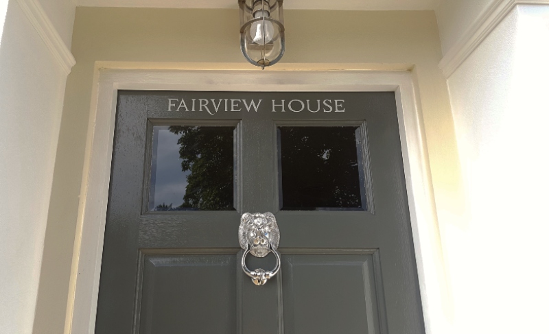 painted house name on wooden front door London