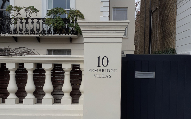 painted street name and house number entrance London
